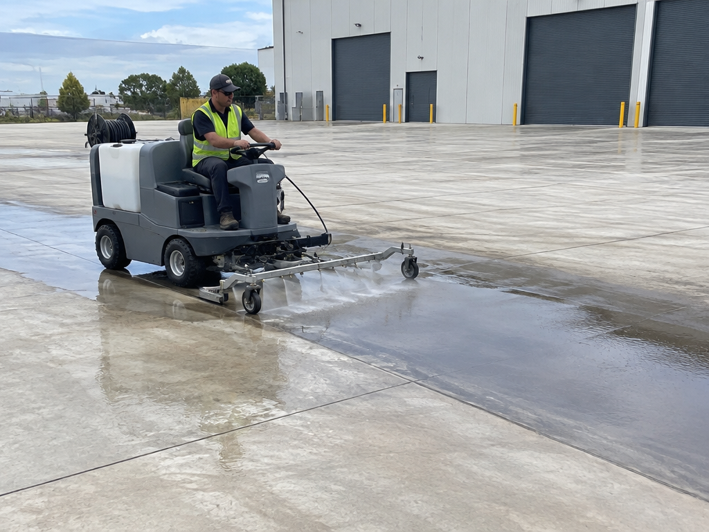 Pressure cleaning a large warehouse concrete hardstand